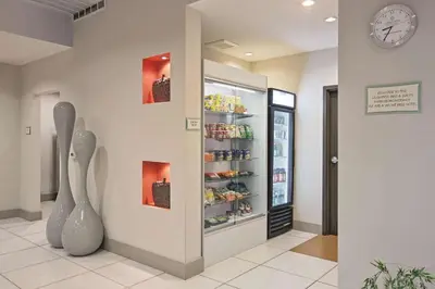 a room with a display case with food at La Quinta by Wyndham Harrisburg-Hershey in Harrisburg