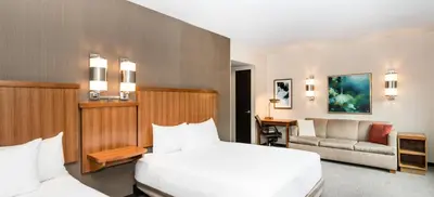 a hotel room with a bed and a couch at Hyatt Place New York/Midtown-South in New York