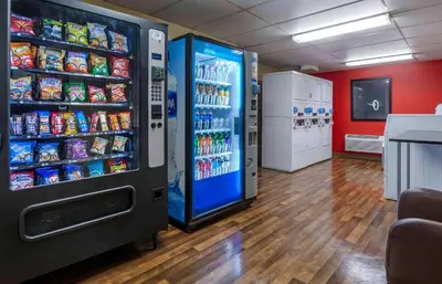 a large vending machine in a store with drinks at Extended Stay America Suites - Edison - Raritan Center in Edison