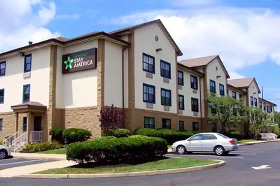 a hotel with a car parked in front of it at Extended Stay America Suites - Edison - Raritan Center in Edison