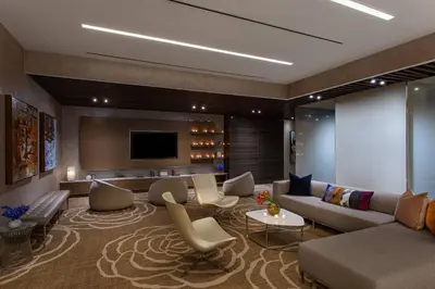 a living room with a couch and a tv at Courtyard New York Manhattan/Midtown West in New York