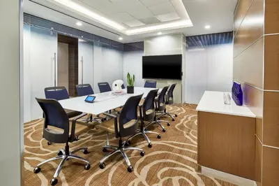 a conference room with a long table and chairs at Courtyard New York Manhattan/Midtown West in New York