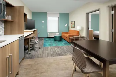 a room with a kitchen and a living room at Home2 Suites By Hilton Edison in Edison