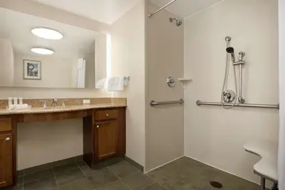 a bathroom with a sink and a shower at Homewood Suites by Hilton Dover - Rockaway in Dover