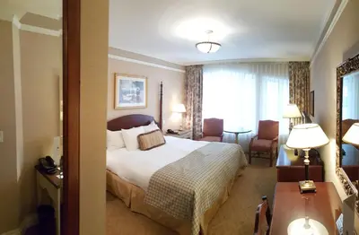 a hotel room with a large bed and a window at The Wall Street Inn in New York