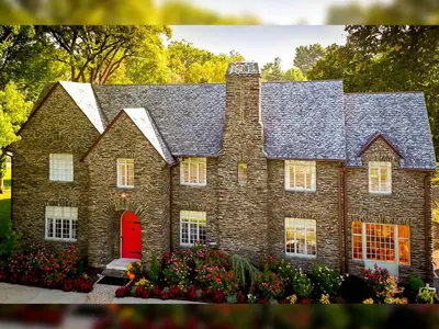 a large brick house with a red door at The Manor on Front in Harrisburg