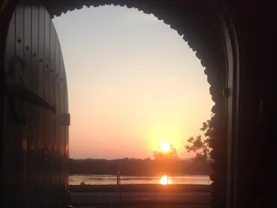 a sunset seen through an archway of a building at The Manor on Front in Harrisburg