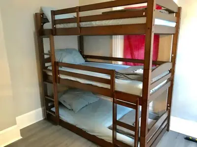a couple of bunk beds in a room at Philly Coed Dorm!! 15 Min Train to Center City!! in Philadelphia