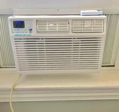 a air conditioner is sitting on a wall at Philly Coed Dorm!! 15 Min Train to Center City!! in Philadelphia