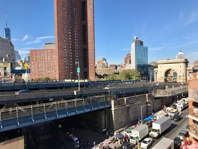 an overhead view of a city with a bridge at Hotel Mimosa in New York