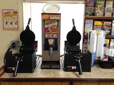 a video game machine sitting on top of a counter at Americas Best Value Inn - Palmyra/Hershey in Palmyra