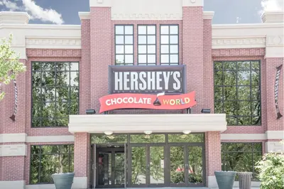 a store front of a brick building with a herrity sign at Knights Inn Pine Grove in Pine Grove