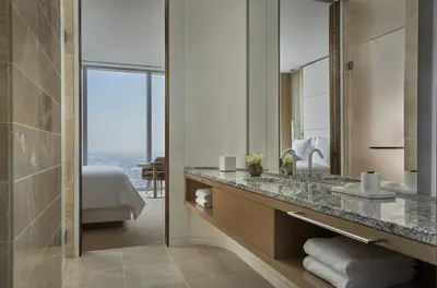 a bathroom with a sink and a large mirror at Four Seasons Hotel Philadelphia at Comcast Center in Philadelphia