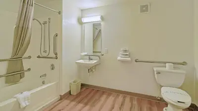 a bathroom with a toilet and a sink and a shower at Motel 6-Maple Shade Township, NJ - Philadelphia - Mt Laurel in Maple Shade