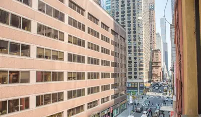 a view of a city street with tall buildings at Da Vinci Hotel in New York