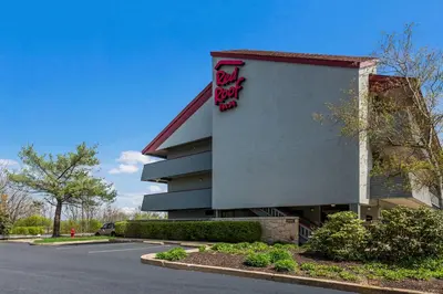 a building with a sign on the side of it at Red Roof Inn Wilkes-Barre Arena in Wilkes-Barre