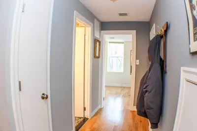 a room with a hallway with blue walls and a door at ⭐️Trendy Apartment⭐️Fishtown⭐️ in Philadelphia