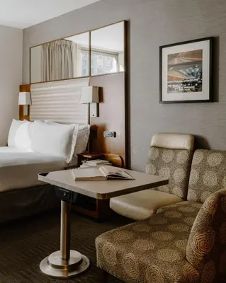 a hotel room with a bed and a table and a chair at Club Quarters Hotel Grand Central, New York in New York
