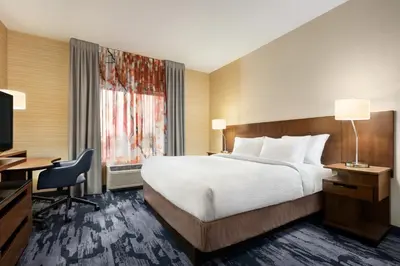 a hotel room with a bed and a desk and a television at Fairfield Inn & Suites by Marriott Hershey Chocolate Avenue in Hershey