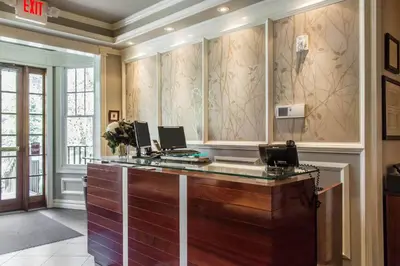 a office with a desk with two computers on it at The Peacock Inn, an Ascend Collection Hotel in Princeton