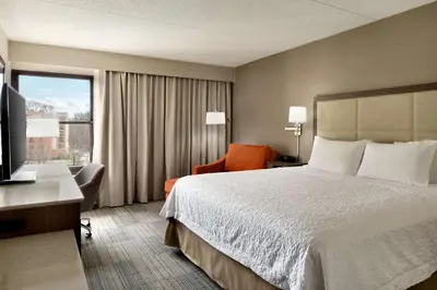 a hotel room with a bed and a window at Hampton Inn Philadelphia/Mt. Laurel in Mount Laurel