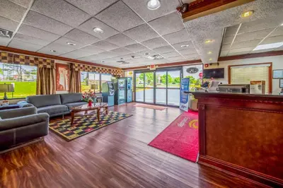 a living room with a couch and a table at Econo Lodge Mount Laurel - Philadelphia East in Mount Laurel