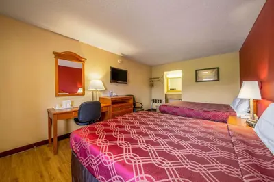 a hotel room with two beds and a desk at Econo Lodge Mount Laurel - Philadelphia East in Mount Laurel