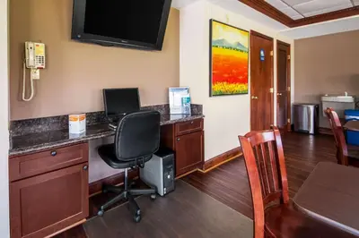 an office with a desk with a computer and a chair at Econo Lodge Mount Laurel - Philadelphia East in Mount Laurel