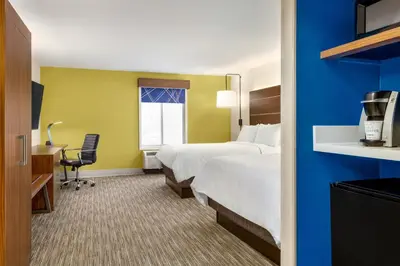 a hotel room with a bed and a desk at Holiday Inn Express & Suites Philadelphia - Mt Laurel by IHG in Mount Laurel