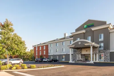a rendering of a hotel with cars parked in a parking lot at Holiday Inn Express & Suites Philadelphia - Mt Laurel by IHG in Mount Laurel