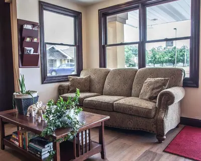 a living room with a couch and a table at Econo Lodge Newton in Newton