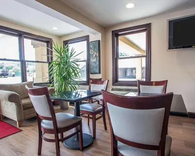 a dining room with a table and chairs at Econo Lodge Newton in Newton