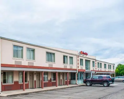 a building with a truck parked in front of it at Econo Lodge Elmira-Corning in Elmira