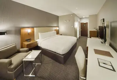 a hotel room with a bed and a couch at DoubleTree by Hilton Nanuet in Nanuet