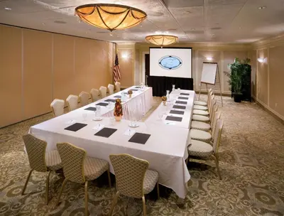 a large meeting room with a long table and chairs at DoubleTree by Hilton Nanuet in Nanuet