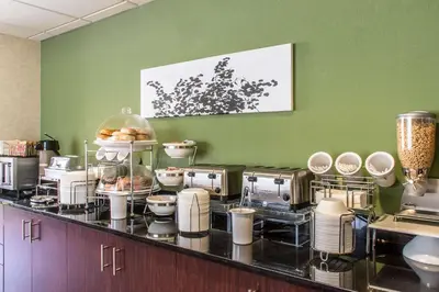 a kitchen with a bunch of food on a counter at Sleep Inn & Suites of Lancaster County in Mountville