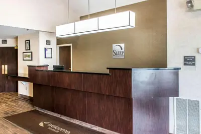 a lobby of a hotel with a reception desk at Sleep Inn & Suites of Lancaster County in Mountville