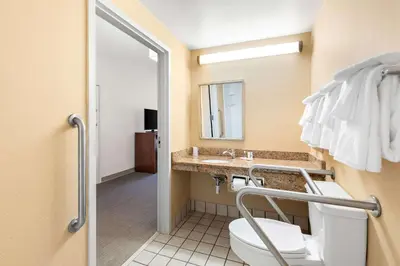 a bathroom with a toilet and a sink at Comfort Inn Pocono Lakes Region in Lake Ariel
