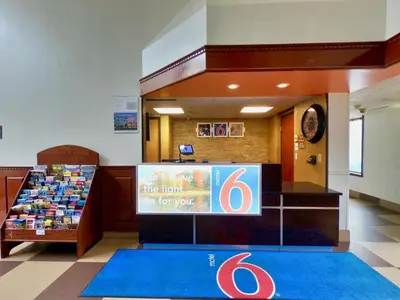 a store with a sign in the middle of a lobby at Motel 6-Levittown, PA - Bensalem in Levittown