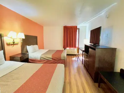 a hotel room with two beds and a television at Motel 6-Levittown, PA - Bensalem in Levittown