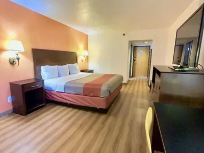 a hotel room with a bed and a television at Motel 6-Levittown, PA - Bensalem in Levittown