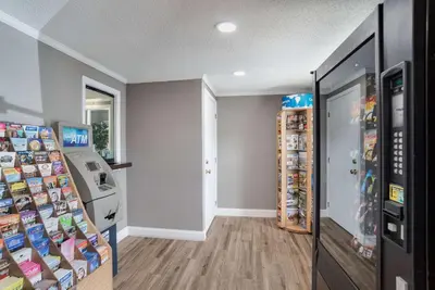 a room with a vending machine and a refrigerator at Rodeway Inn Carlisle North in Carlisle