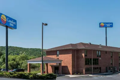 a building with a street sign in front of it at Comfort Inn Pine Grove I-81 Hershey Area in Pine Grove