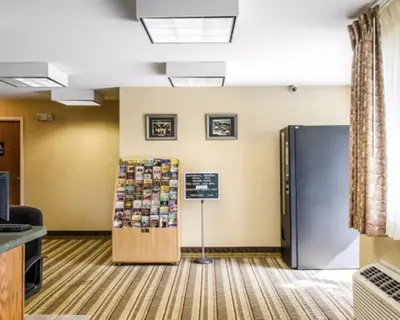 a waiting room with a refrigerator in a office at Rodeway Inn & Suites Hershey Chocolate Avenue in Hershey