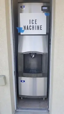 a microwave oven with a sign that reads life machine at Rodeway Inn & Suites Hershey Chocolate Avenue in Hershey