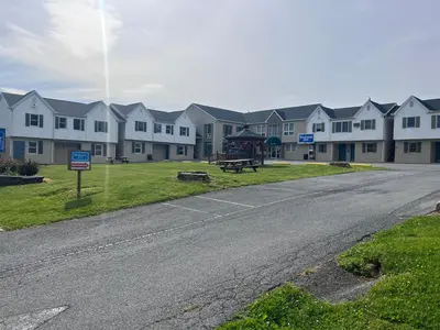 an empty street in front of a row of houses at Rodeway Inn & Suites Hershey Chocolate Avenue in Hershey