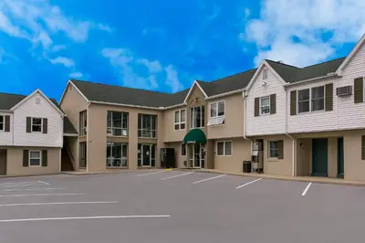 a view of a building with a parking lot at Rodeway Inn & Suites Hershey Chocolate Avenue in Hershey