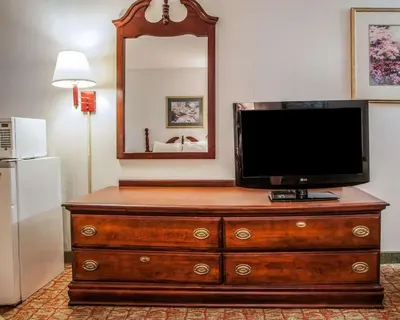 a television on top of a dresser in a room at Econo Lodge Douglassville-Pottstown in Douglassville