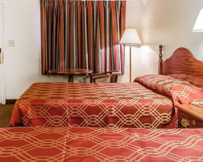 a hotel room with two beds and a window at Econo Lodge Frackville in Frackville