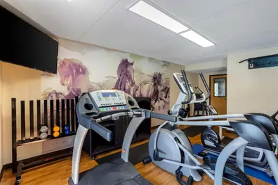 a gym with two exercise bikes in a room at Best Western Harrisburg North Hershey in Harrisburg